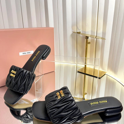 MIUMIU 26S MATELASSE SLIDES IN BLACK CALFSKIN GOLD HARDWARE