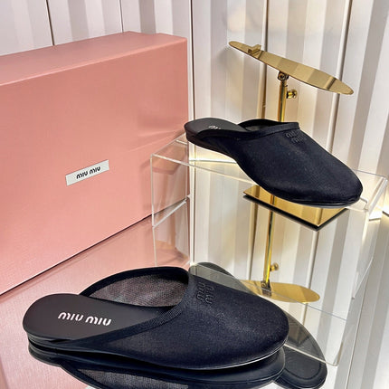 MIUMIU 26S FLAT MULES IN BLACK FABRIC AND LEATHER 
