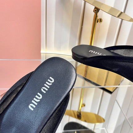 MIUMIU 26S FLAT MULES IN BLACK FABRIC AND LEATHER 
