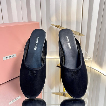 MIUMIU 26S FLAT MULES IN BLACK FABRIC AND LEATHER 
