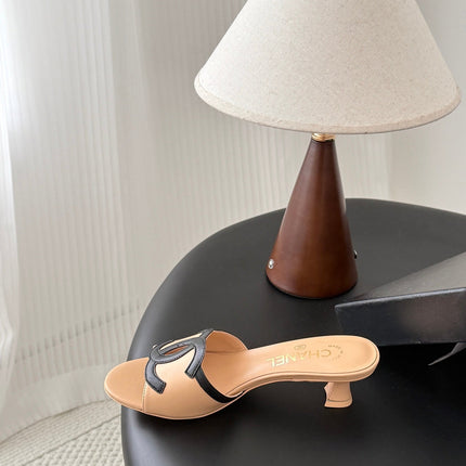 CHANEL MULES IN BEIGE AND BLACK CALFSKIN