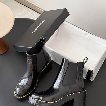 CHANEL 26S CHELSEA ANKLE BOOTS 70 MM IN BLACK EMBOSSED AND PATENT