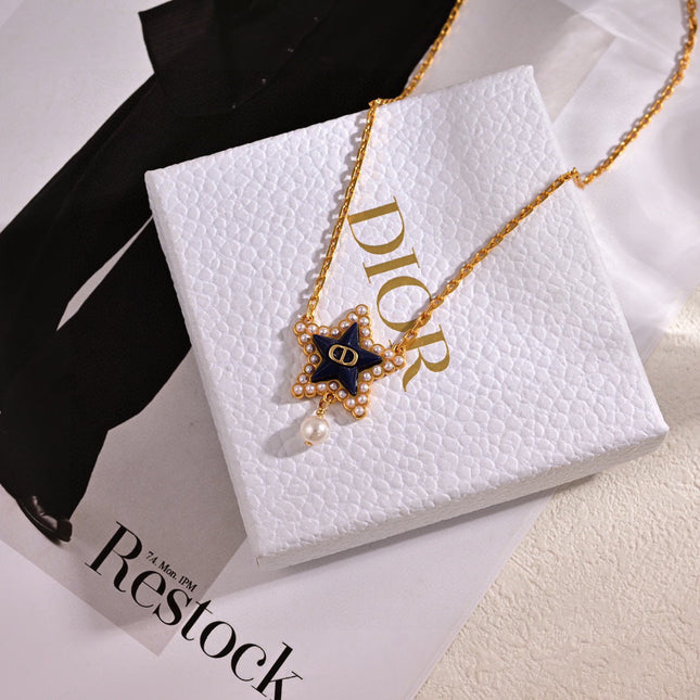 CD 26S PEARL STAR LOGO PENDANT NECKLACE IN GOLD TONE METAL