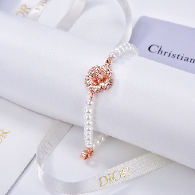 CD 26S PEARL FLOWER CHARM BRACELET IN ROSE GOLD TONE METAL 631860