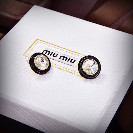MIUMIU 26S ROUND CRYSTAL STUD EARRINGS IN BLACK RESIN AND GOLD TONE METAL 633262