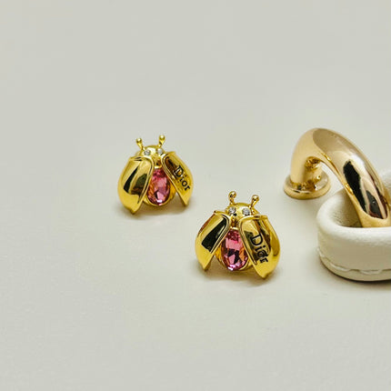 CD 26S LADYBUG PINK CRYSTAL STUD EARRINGS IN GOLD TONE METAL 644370