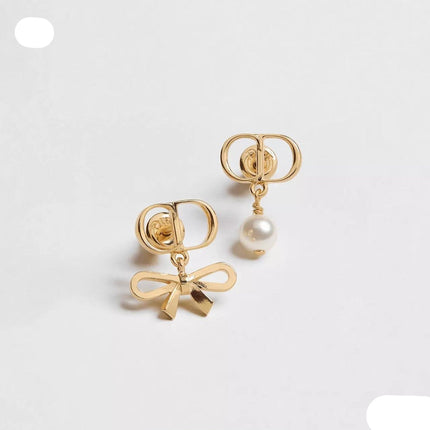 CD 26S MINI BOW PEARL DROP EARRINGS IN GOLD TONE METAL 646612