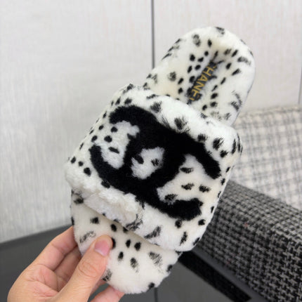 CHANEL 26S PLATFORM SLIDE SANDALS IN WHITE AND BLACK SHEARLING DALMATIAN PRINT
