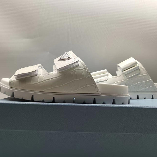 PRADA 26S STRAP SLIDES IN IVORY WHITE CROC EMBOSSED CALFSKIN