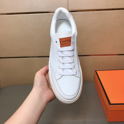 LV TRAINER IN EMBOSSED WHITE SUEDE