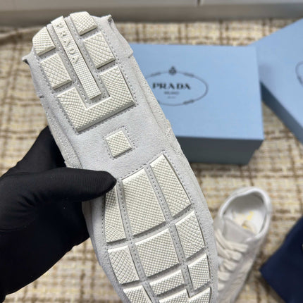 PRADA 26S LOW TOP SNEAKERS IN WHITE NYLON AND SUEDE