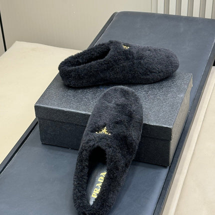 PRADA 25S CLOGS IN BLACK SHEARLING