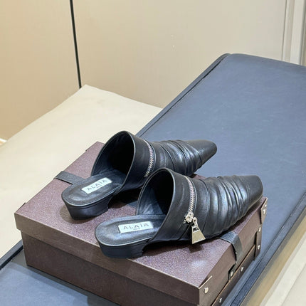 ALAIA 26S PLEATED MULES IN BLACK LAMBSKIN