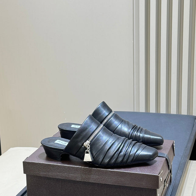 ALAIA 26S PLEATED MULES IN BLACK LAMBSKIN