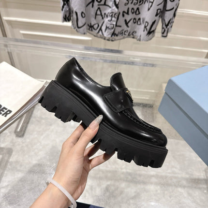 PRADA 26S PLATFORM LOAFERS 45MM IN BLACK SHINE CALFSKIN