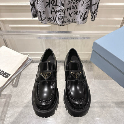 PRADA 26S PLATFORM LOAFERS 45MM IN BLACK SHINE CALFSKIN