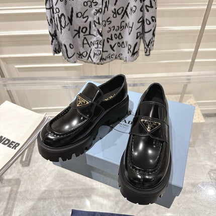 PRADA 26S PLATFORM LOAFERS 45MM IN BLACK SHINE CALFSKIN
