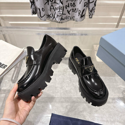 PRADA 26S PLATFORM LOAFERS 45MM IN BLACK SHINE CALFSKIN