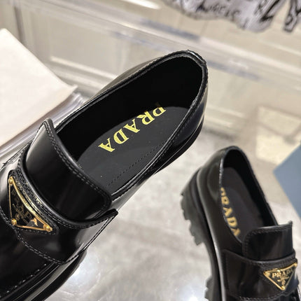 PRADA 26S PLATFORM LOAFERS 45MM IN BLACK SHINE CALFSKIN