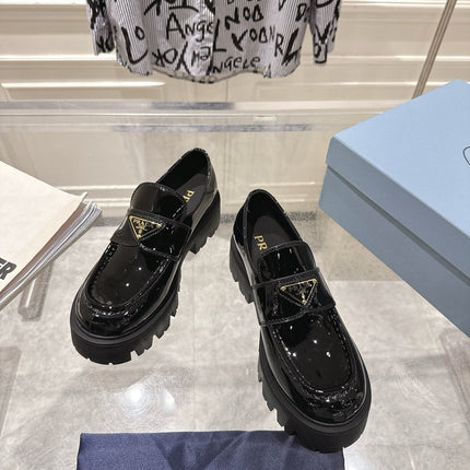PRADA 26S PLATFORM LOAFERS 45MM IN BLACK PATENT CALFSKIN