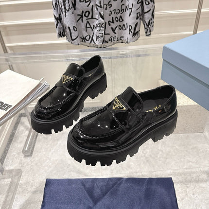PRADA 26S PLATFORM LOAFERS 45MM IN BLACK PATENT CALFSKIN