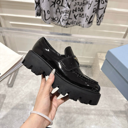 PRADA 26S PLATFORM LOAFERS 45MM IN BLACK PATENT CALFSKIN