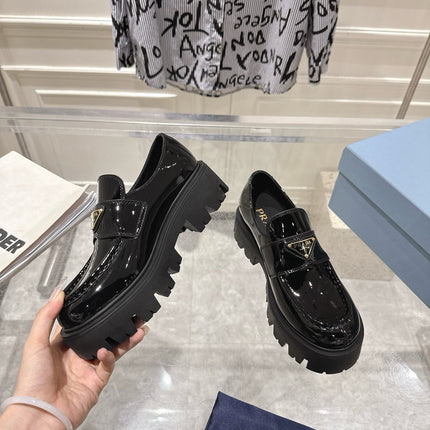 PRADA 26S PLATFORM LOAFERS 45MM IN BLACK PATENT CALFSKIN