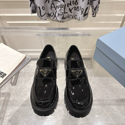 PRADA 26S PLATFORM LOAFERS 45MM IN BLACK PATENT CALFSKIN
