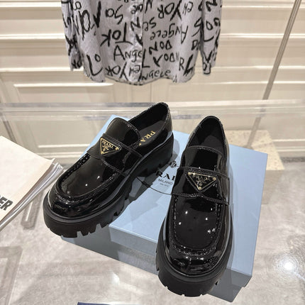 PRADA 26S PLATFORM LOAFERS 45MM IN BLACK PATENT CALFSKIN