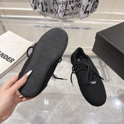 PRADA 26S COLLAPSE SNEAKERS IN BLACK CANVAS