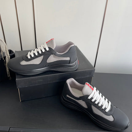 PRADA 26S AMERICA CUP SNEAKERS IN BLACK SOFT RUBBER AND BIKE FABRIC