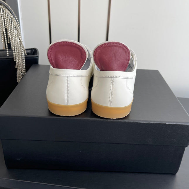 CHANEL LOW-TOP SNEAKERS IN BLACK AND WHITE CALFSKIN MIX SUEDE