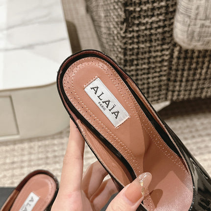 ALAIA SPIKE JEWEL MULES IN BLACK GLOSSY CALFSKIN