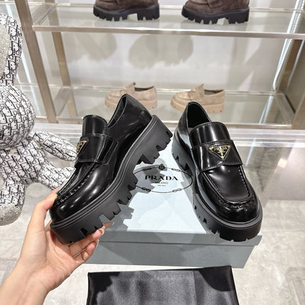 PRADA 25S THICK-SOLE LOAFERS 60 MM IN BLACK CALFSKIN