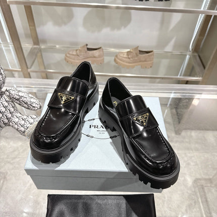 PRADA 25S THICK-SOLE LOAFERS 60 MM IN BLACK CALFSKIN