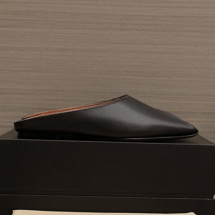ALAIA FLAT MULE IN BLACK LAMBSKIN
