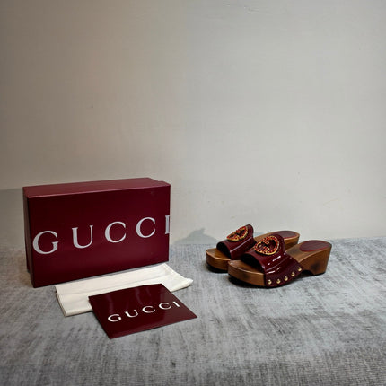 GUCCI 26S PLATFORM MULES IN BURGUNDY RED PATENT CALFSKIN GOLD HARDWARE