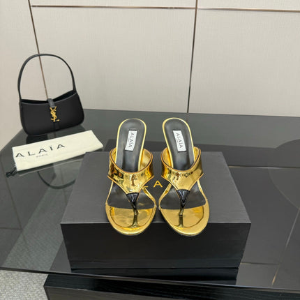 ALAIA HEELED THONG 25S IN GOLD PATENT LEATHER