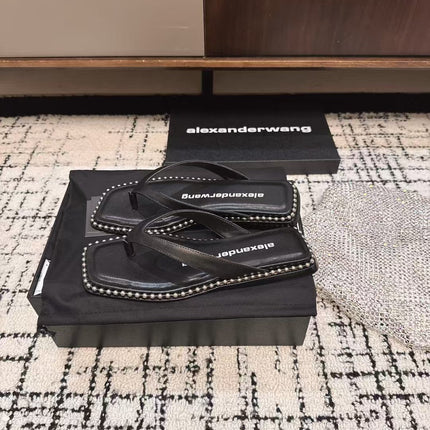 RHODES STUDDED THONG SANDAL IN BLACK CALFSKIN