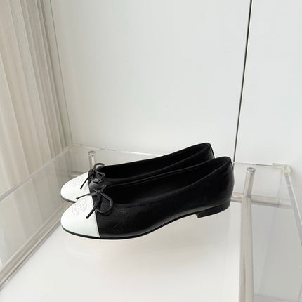 CHANEL 26S BALLET FLATS IN BLACK CRACKED CALFSKIN WITH WHITE TOE CAP AND BOW