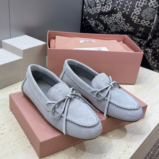 MIUMIU 26S LOAFERS IN LIGHT BLUE SUEDE WITH BOW