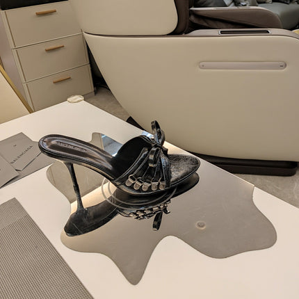BOW-EMBELLISHED HIGH MULES IN BLACK SHEEPSKIN