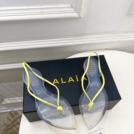 ALAIA 26S POINTED-TOE THONG SANDALS IN YELLOW AND TRANSPARENT PVC