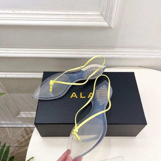 ALAIA 26S POINTED-TOE THONG SANDALS IN YELLOW AND TRANSPARENT PVC