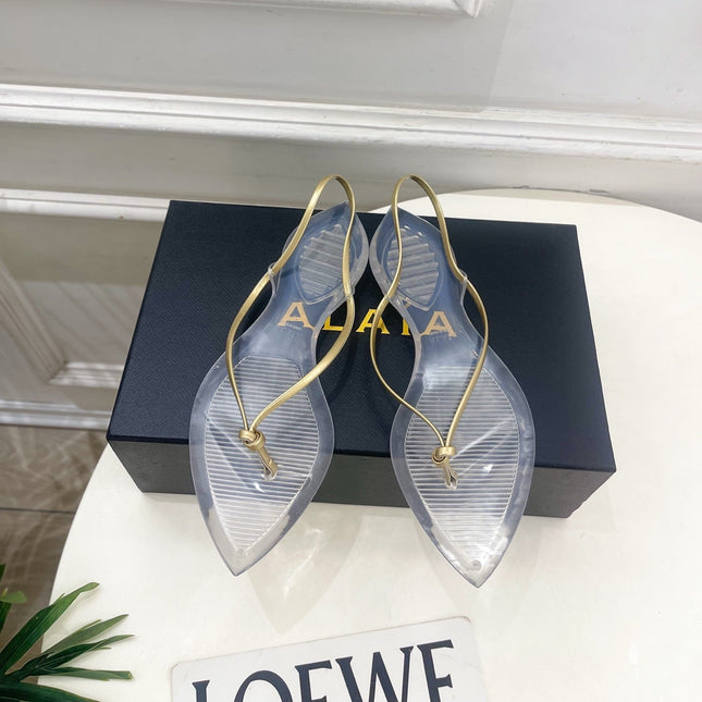 ALAIA 26S POINTED-TOE THONG SANDALS IN GOLD AND TRANSPARENT PVC