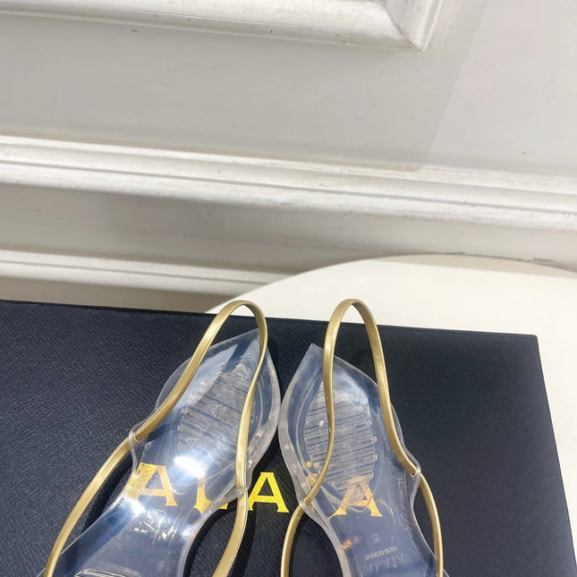 ALAIA 26S POINTED-TOE THONG SANDALS IN GOLD AND TRANSPARENT PVC