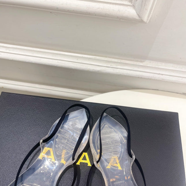ALAIA 26S POINTED-TOE THONG SANDALS IN BLACK SATIN AND TRANSPARENT PVC
