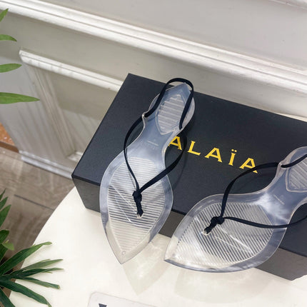 ALAIA 26S POINTED-TOE THONG SANDALS IN BLACK SATIN AND TRANSPARENT PVC