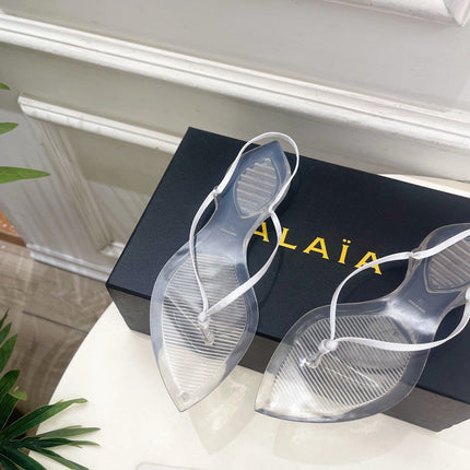 ALAIA 26S POINTED-TOE THONG SANDALS IN WHITE SATIN AND TRANSPARENT PVC