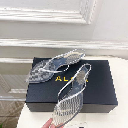 ALAIA 26S POINTED-TOE THONG SANDALS IN WHITE SATIN AND TRANSPARENT PVC